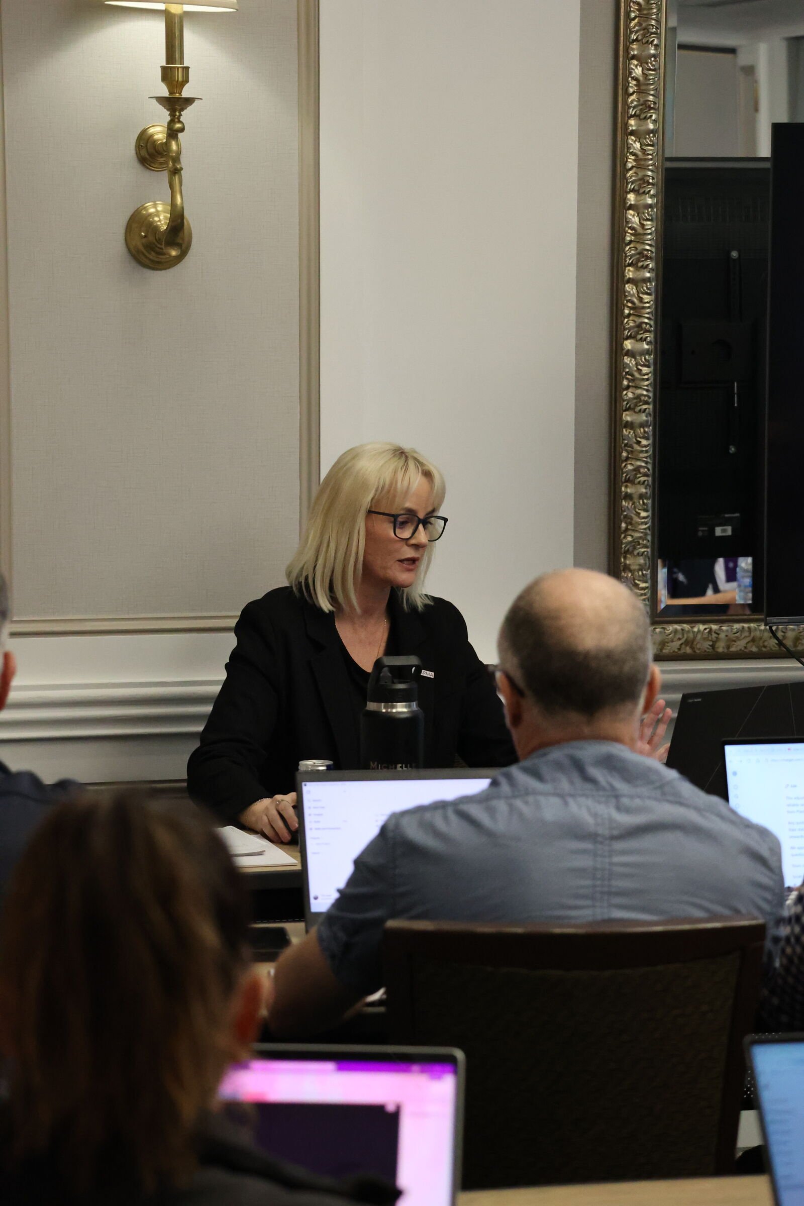 Michelle Rose presenting to a conference audience